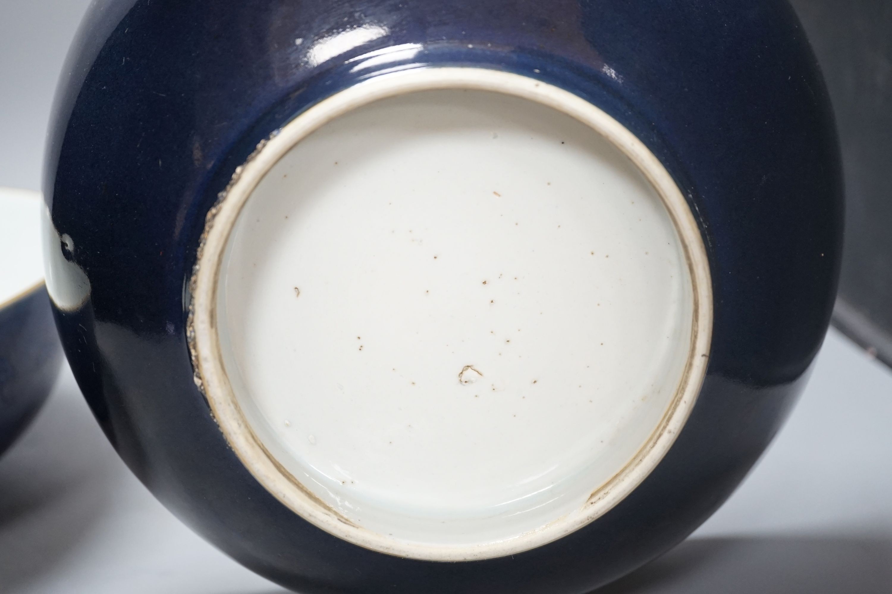 A pair of 18th century Chinese export blue ground punch bowls, 26 cms diameter